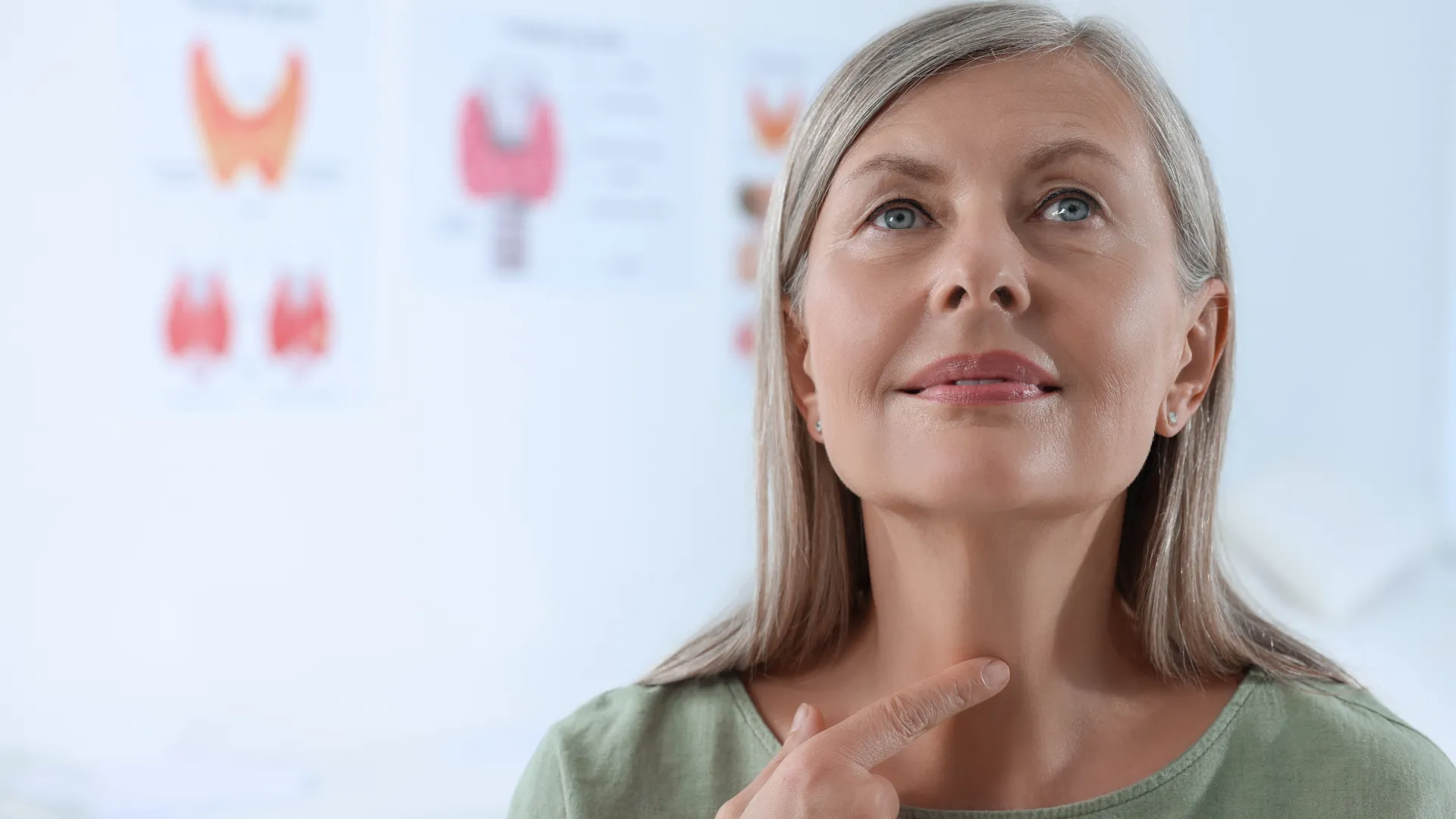 woman looking up in front of medical poster