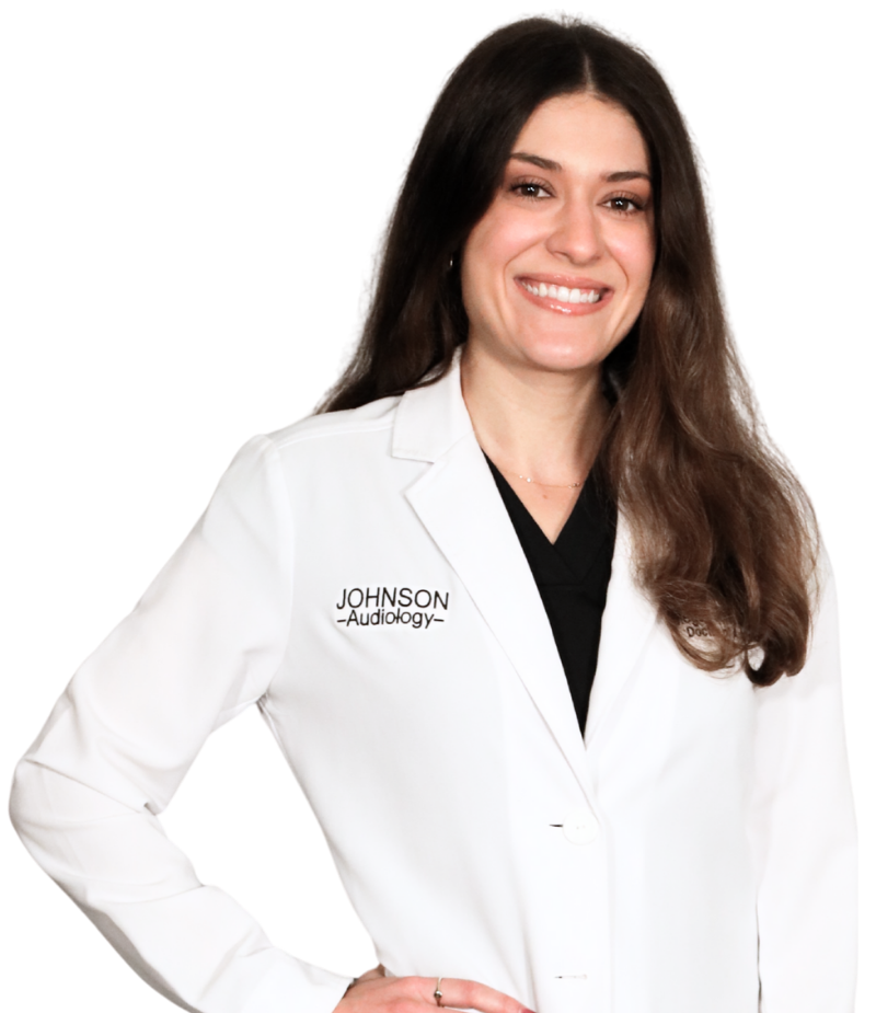 A woman in a white lab coat, smiling, with the name 