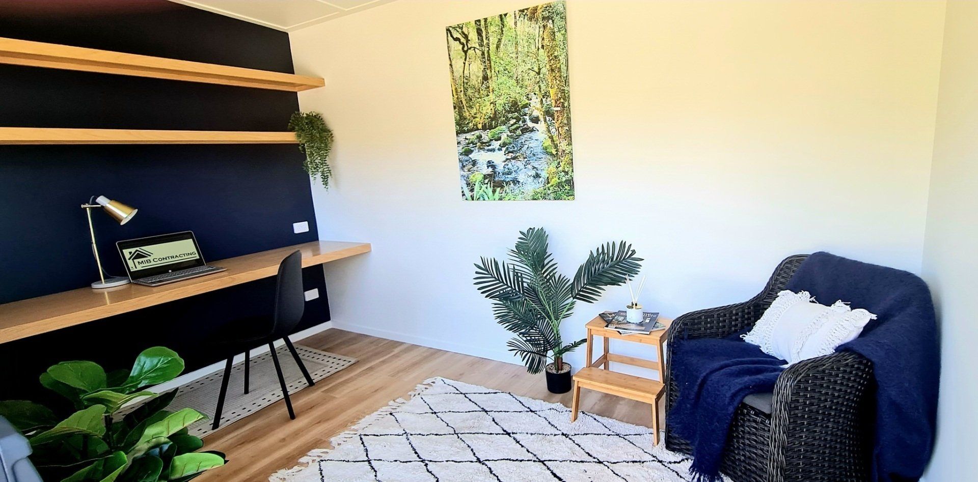 There is a chair and a desk in the room.
