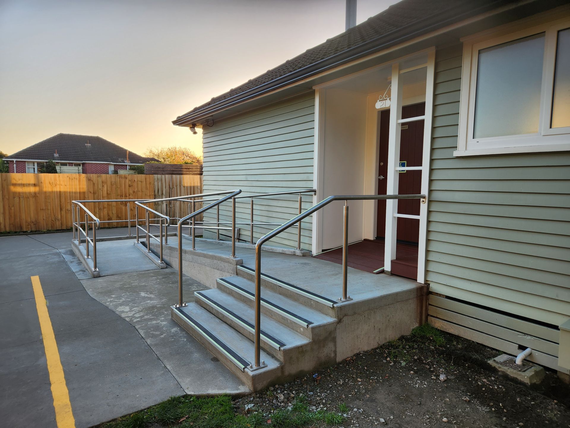 A house with a ramp and stairs leading up to it