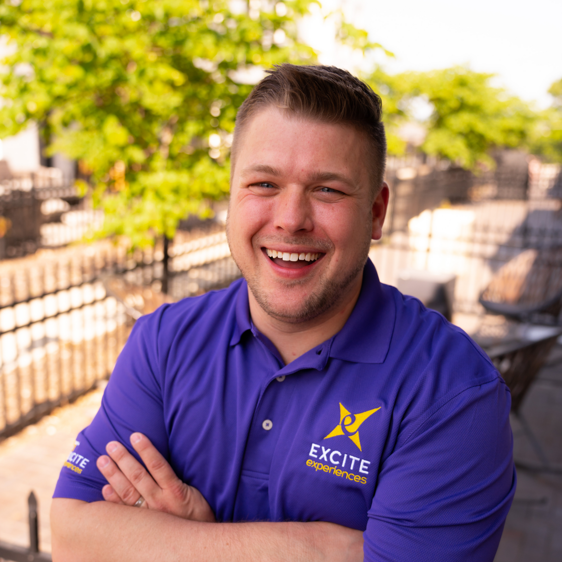 Man in purple polo shirt with 