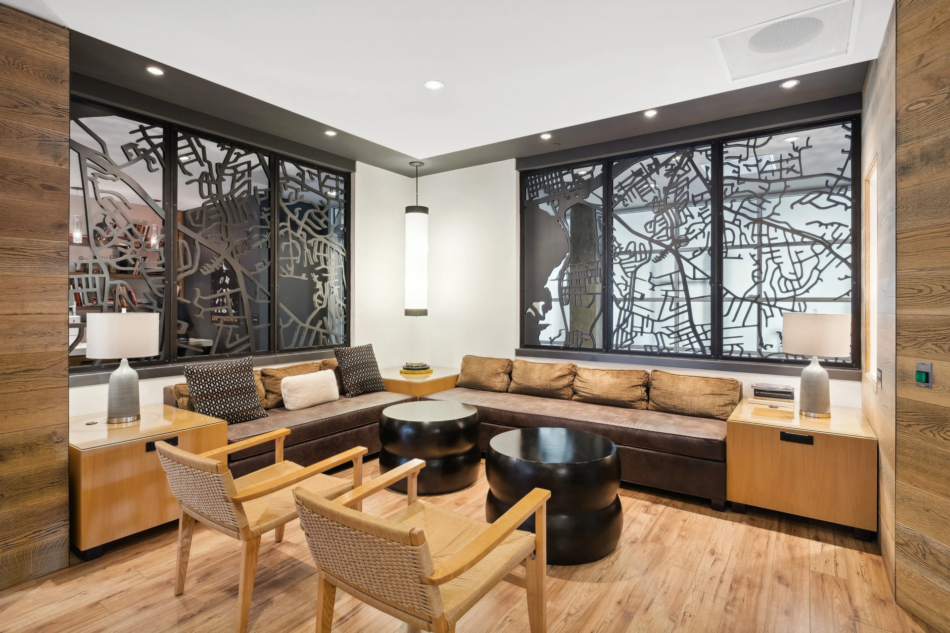 A living room with a couch , chairs , and a table.