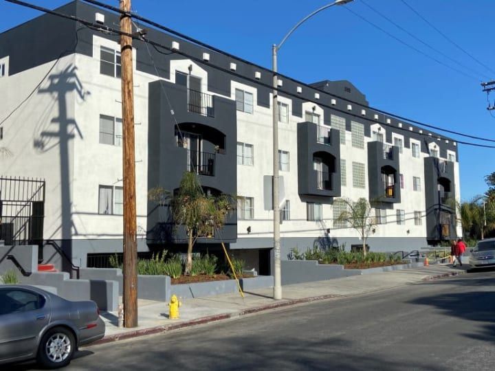 A building with a fire hydrant in front of it