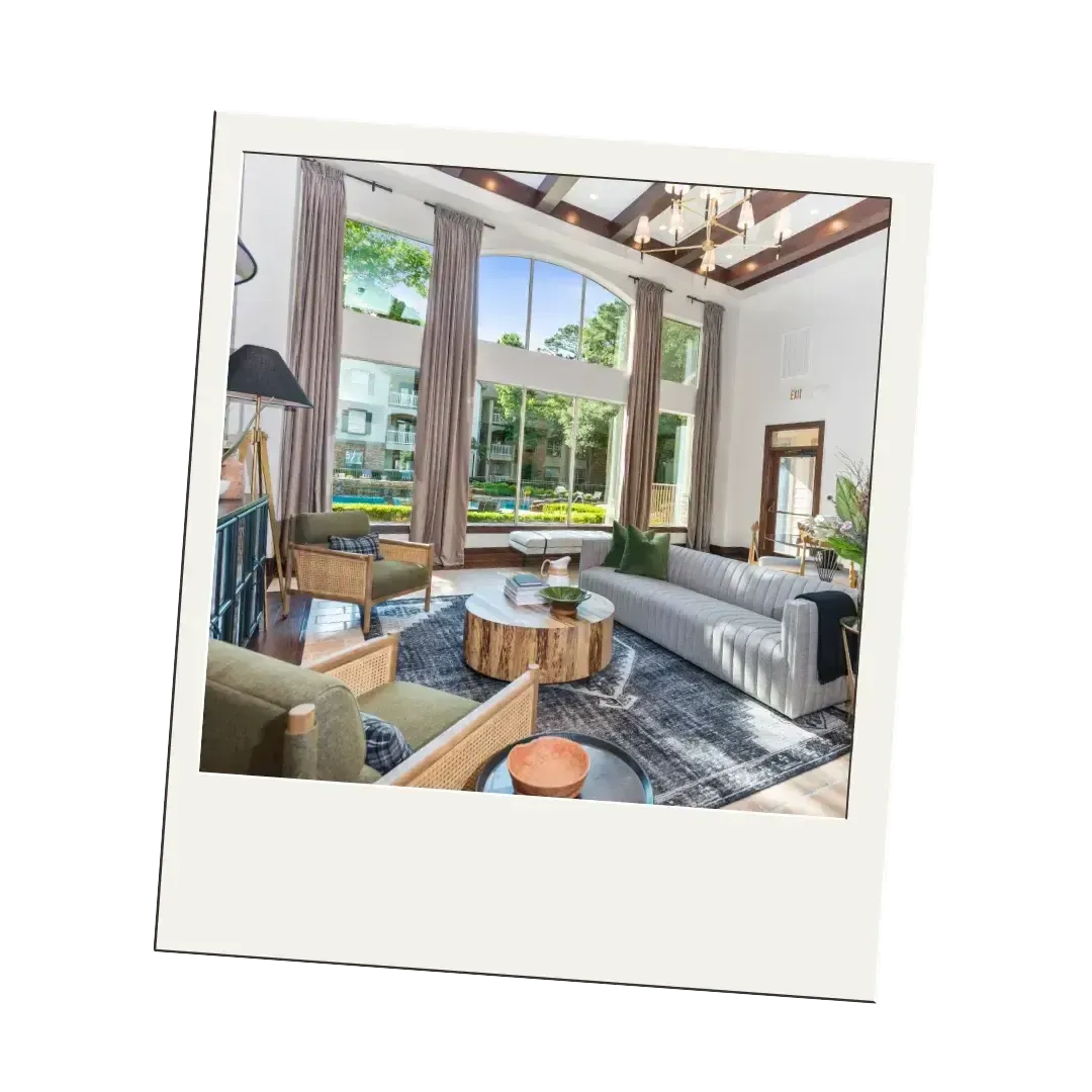 A living room with a couch, chairs, and a coffee table.
