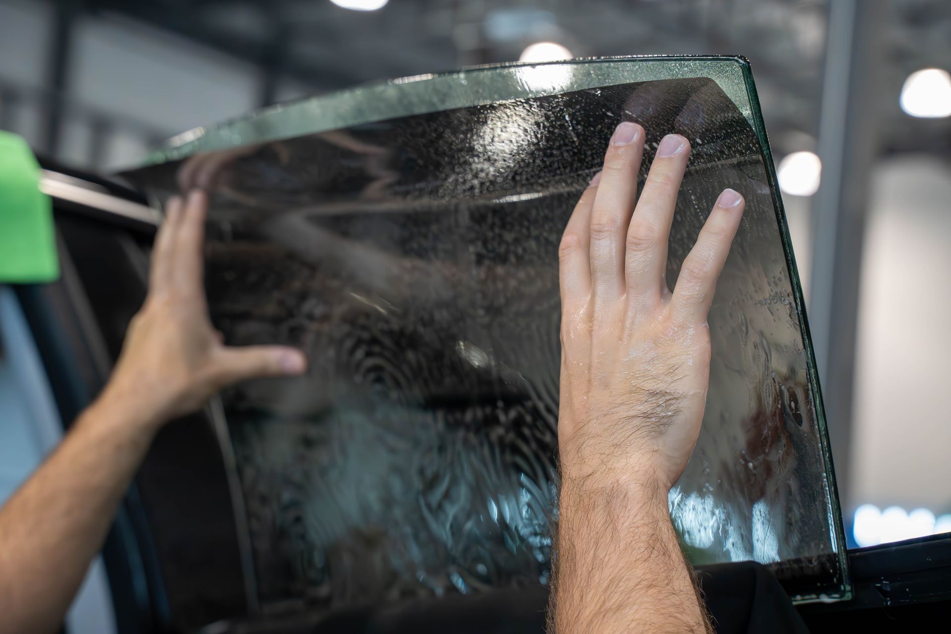 A close up of a car windshield in a showroom.