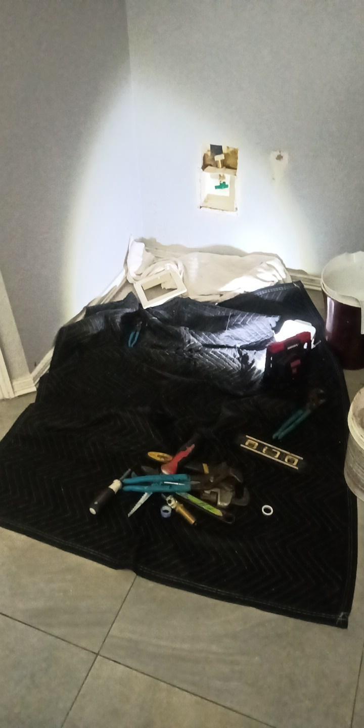 Plumbing Tools Laid Out On A Black Mat
