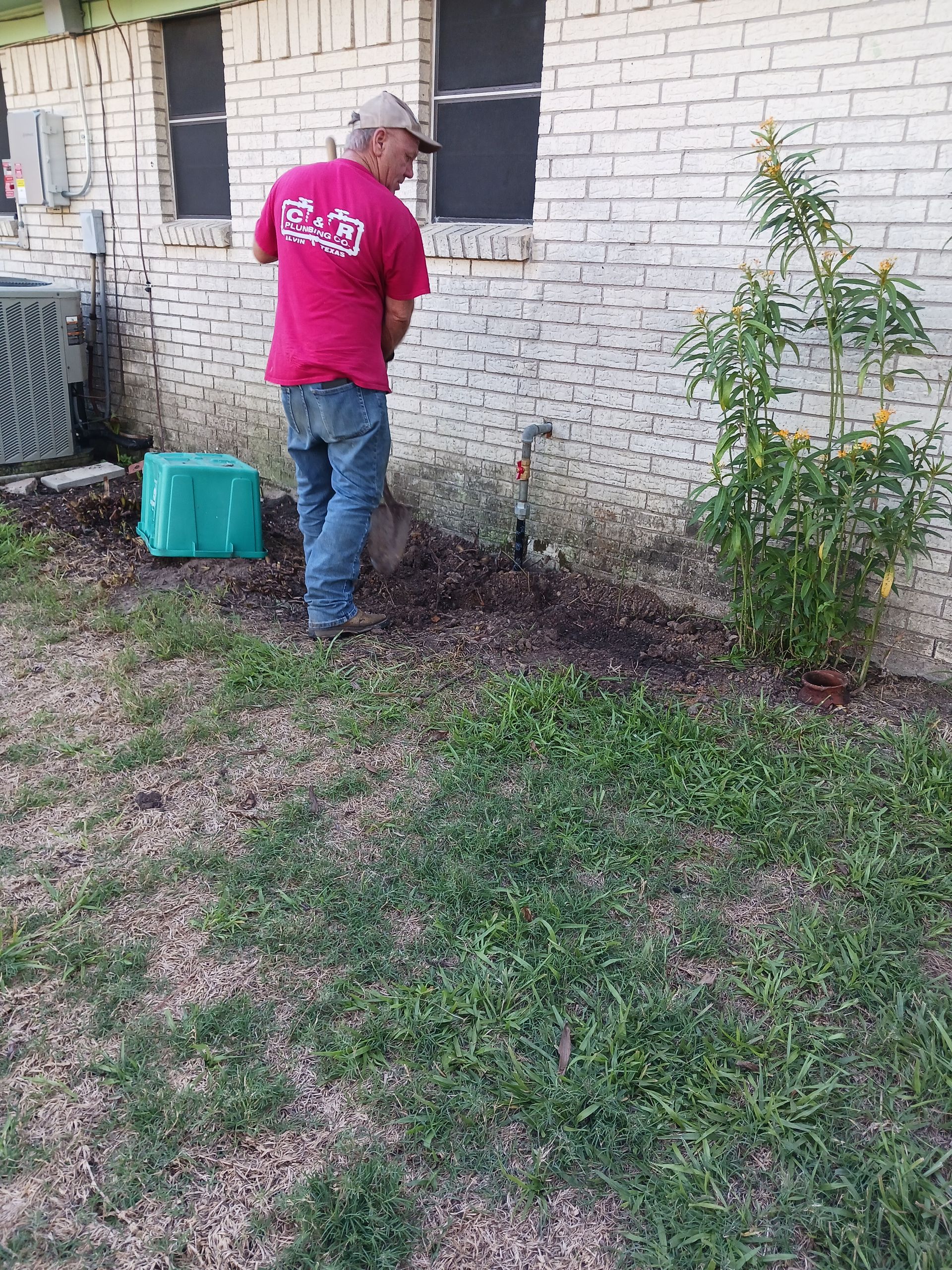 Man Digging A Trench
