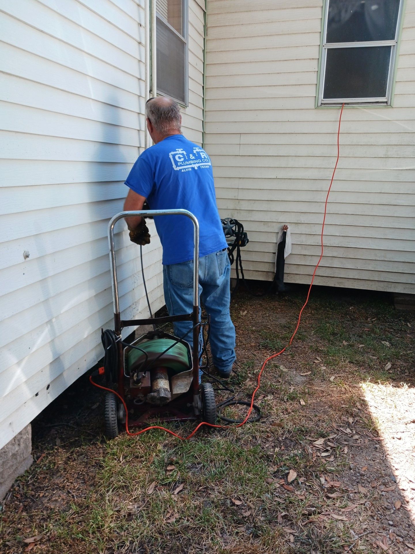 Plumbing is operating a camera and line locator machine
