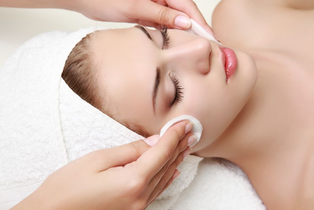 A Woman Is Getting A Facial Treatment — Mackay Skin Clinic In Airlie Beach, QLD