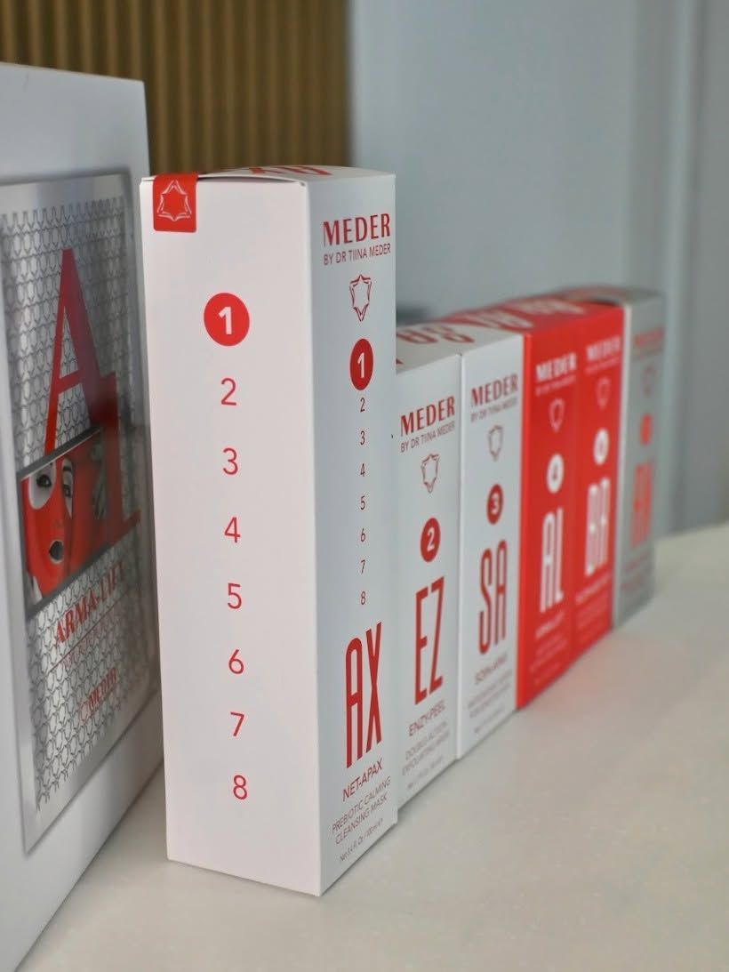 Boxed Red And White Product Packages Lined up On a Shelf — Mackay Skin Clinic In North Mackay, QLD
