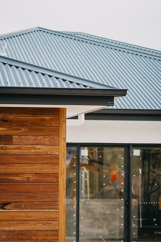 Newly Renovated House with Wooden Walls and Blue Roofing — Imperial Build Co. in Coombs, ACT