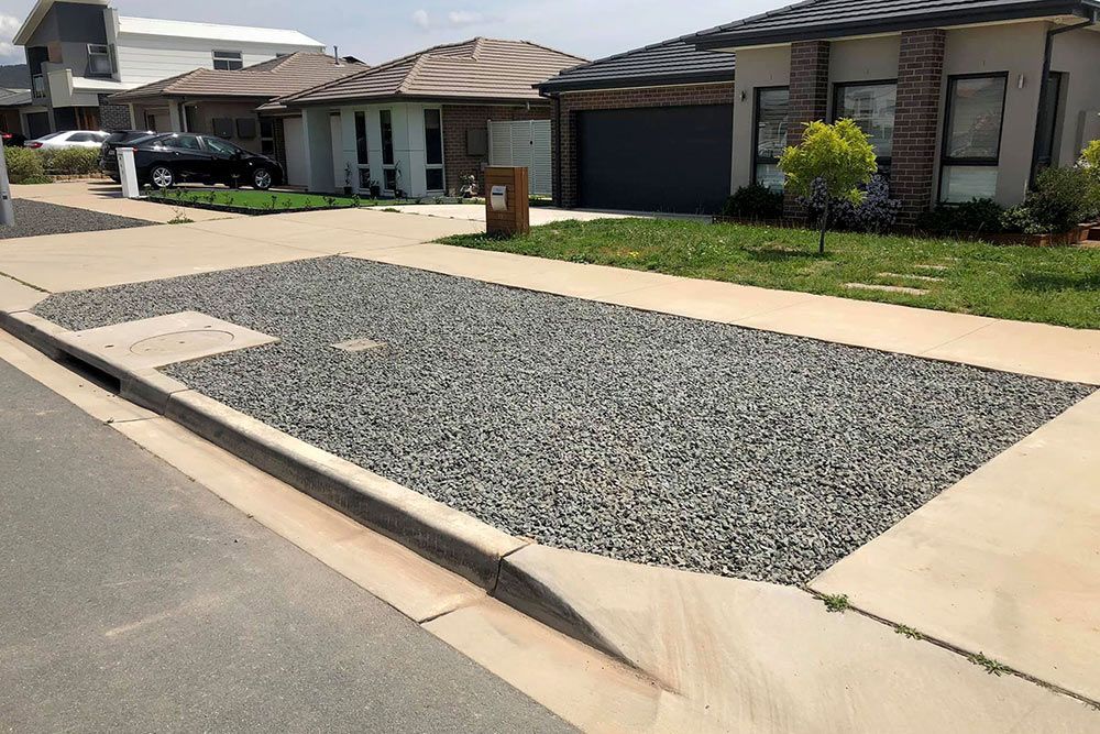 A Gravel Driveway in Front of a House in a Residential Area — Imperial Build Co. in Coombs, ACT