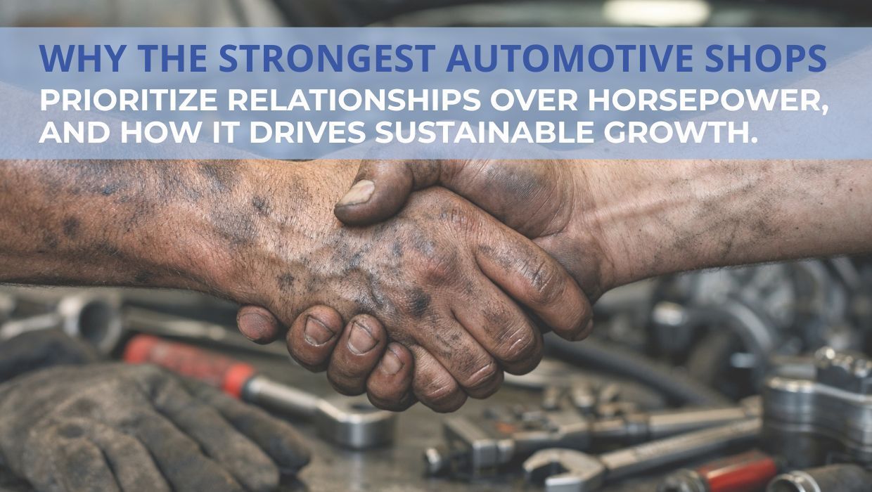 Close-up of two grease-stained hands shaking inside an automotive repair shop, symbolizing trust, strong relationships, and customer-focused growth in custom, restoration, and performance automotive businesses.