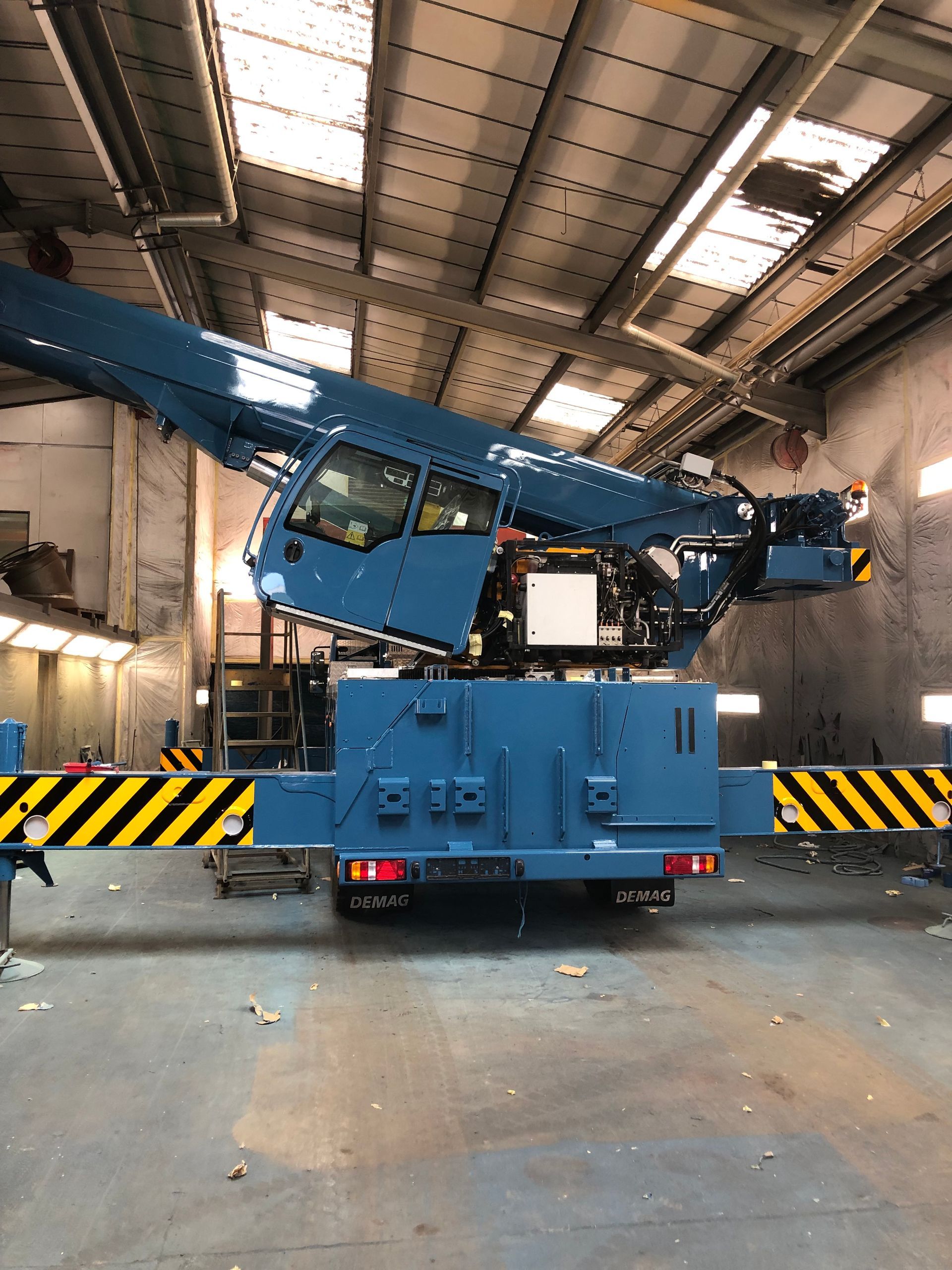 Spot blasting  and painting the crane