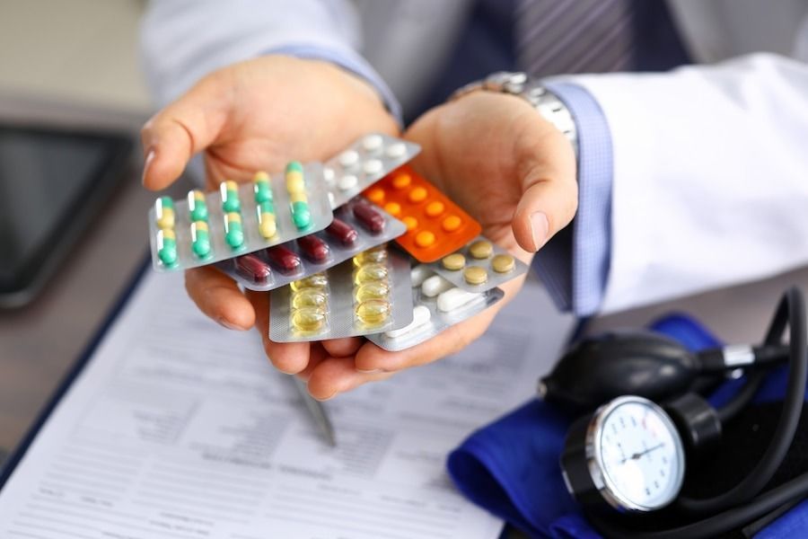 Doctor Holding Pack Of Tablets Pills