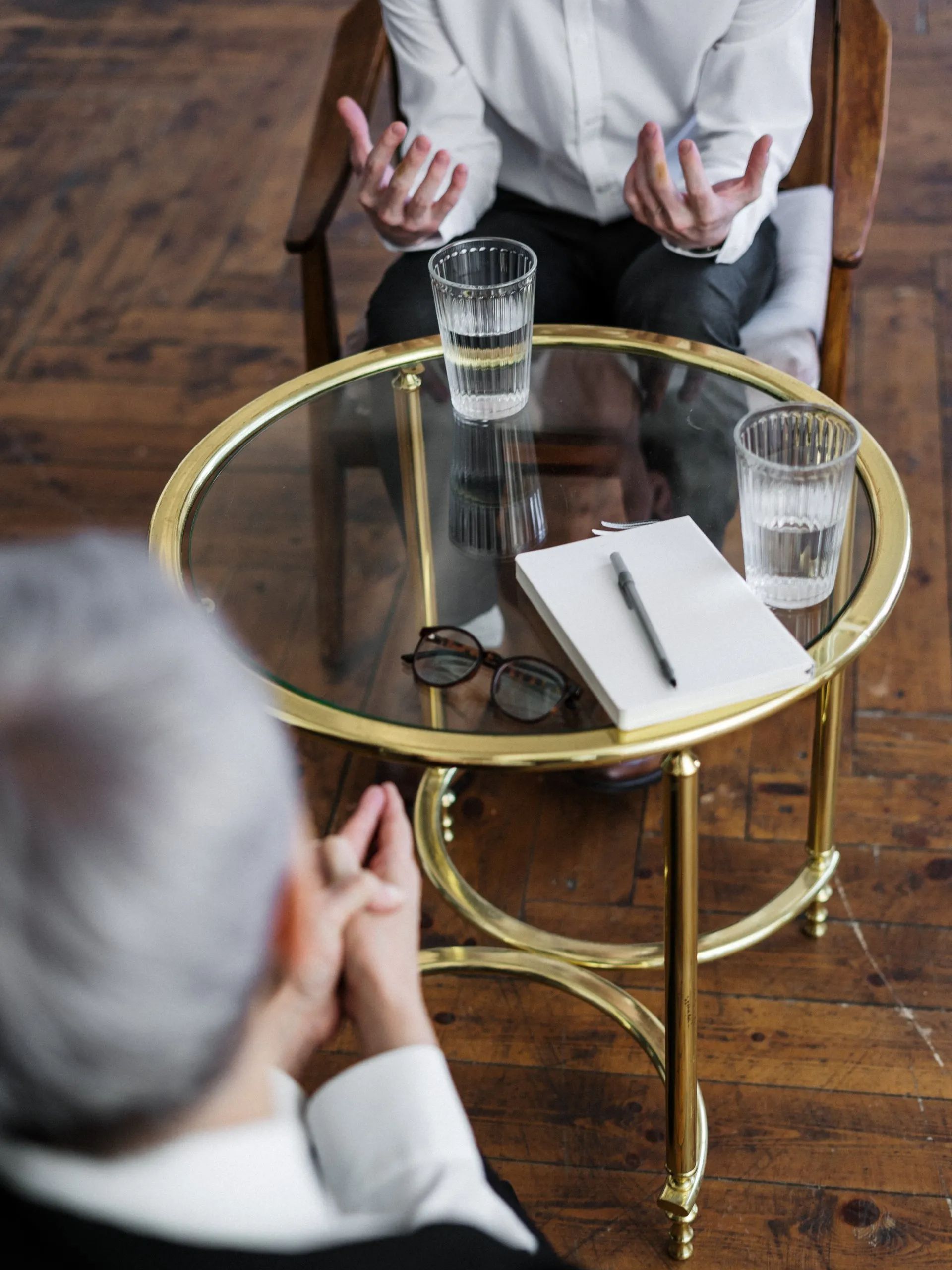sitting at a table talking about psychotherapy