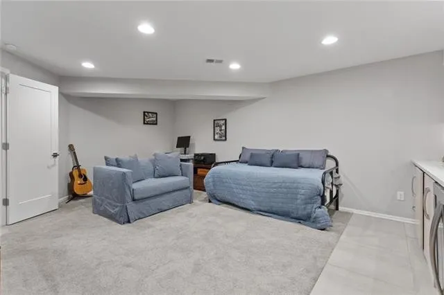 carpet room with led lights on ceiling