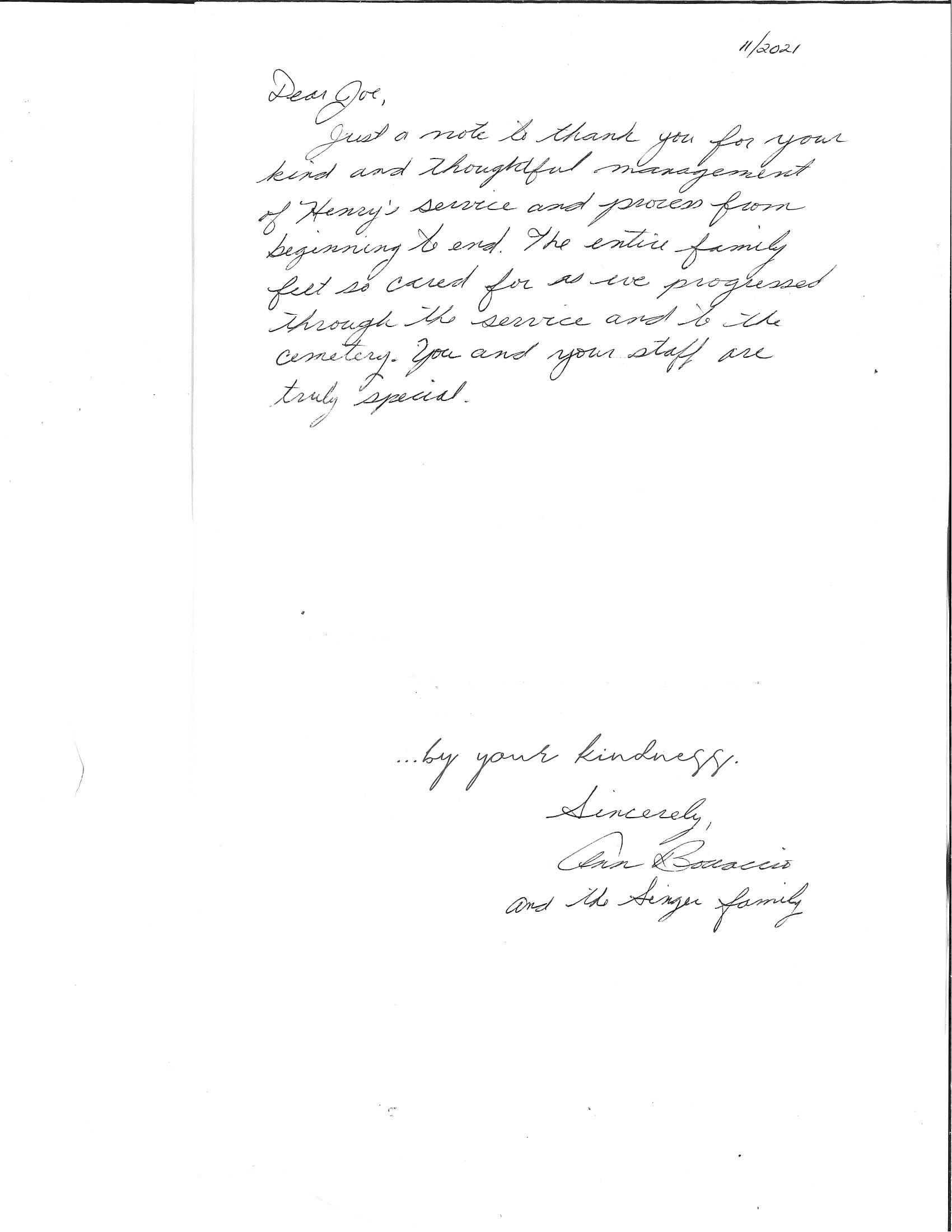 Handwritten note on a white page, with a short signature near the bottom.