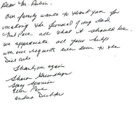 Handwritten letter signed by four people on white paper.