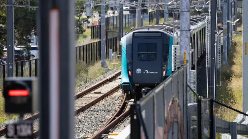 Metro train arriving at a station platform in a tunnel