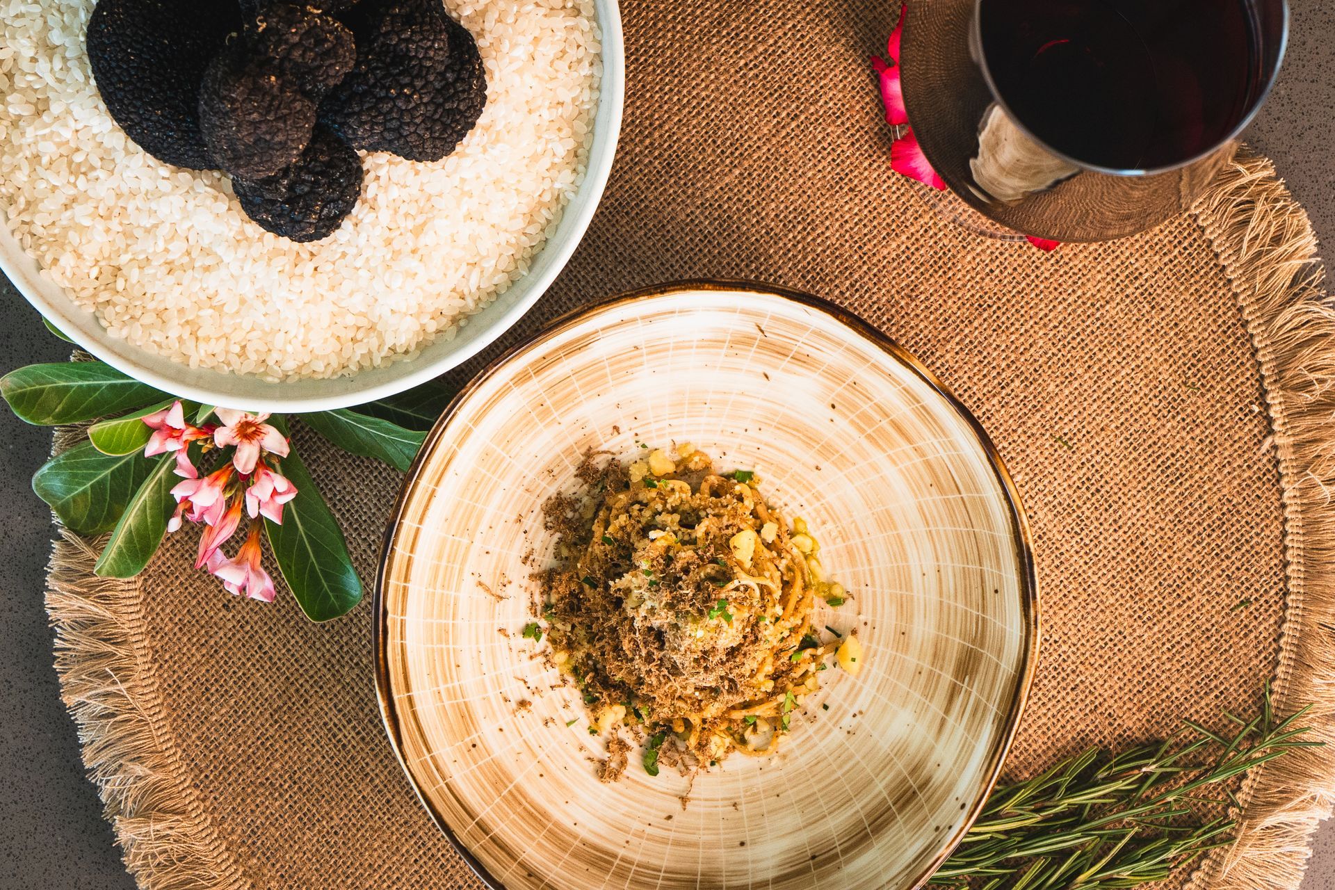 Pasta with truffles and grated cheese, served with wine.
