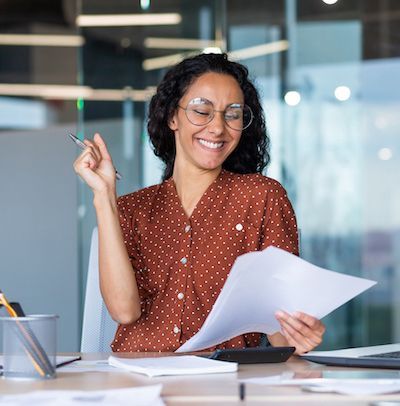 Happy woman client looking at successful business plan with excitement and satisfaction.