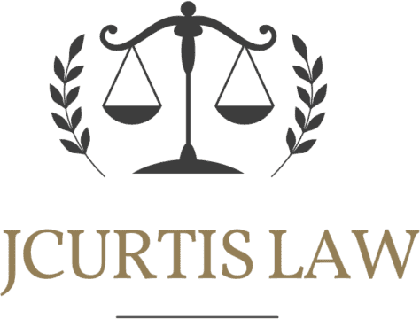 JCURTIS LAW logo with a black scales of justice icon and gold text on a white background