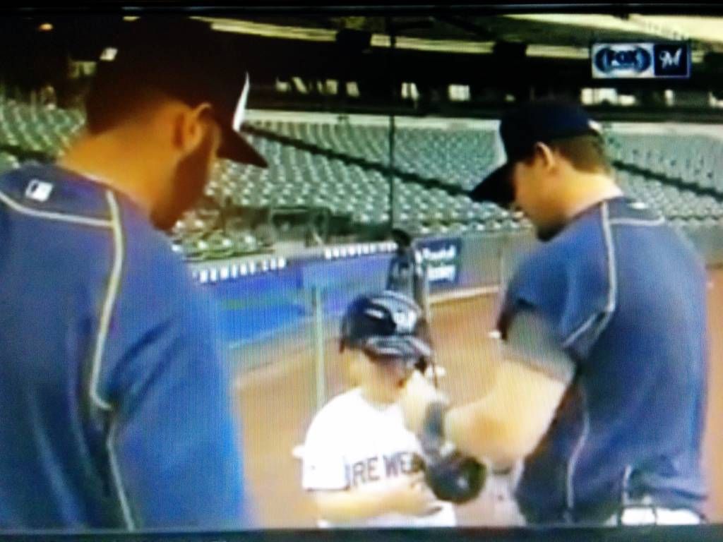 Villar Gennett Luka Scooter helps Luka put on batting gloves