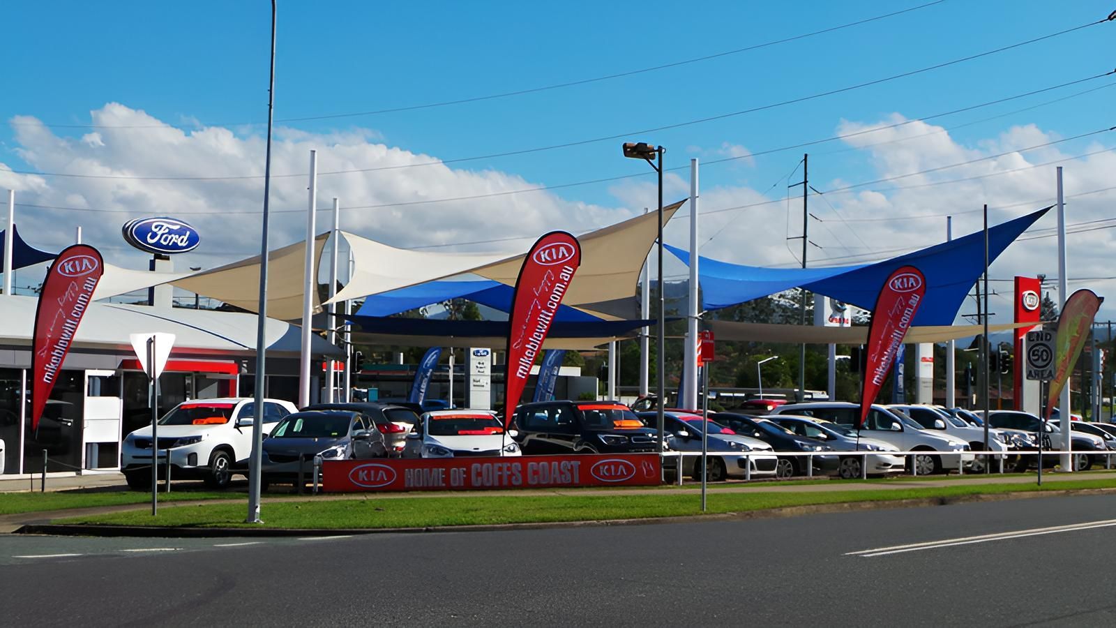 A lot of Cars Are Parked in Front of A Car Dealership — Jon Wilson Canvas & Shade in Coffs Harbour, NSW