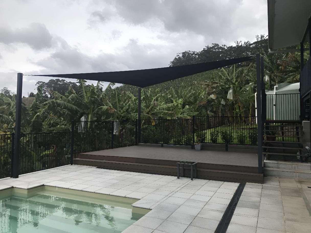 There Is a Swimming Pool with A Canopy Over It — Jon Wilson Canvas & Shade in Coffs Harbour, NSW