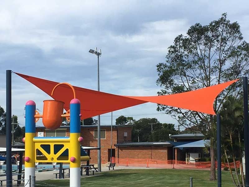 A Colorful Playground with A Large Orange Triangle Shade — Jon Wilson Canvas & Shade in Coffs Harbour, NSW
