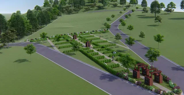 Landscaped roadway with curved asphalt lanes, trees, and a brick entrance sign in a green park setting