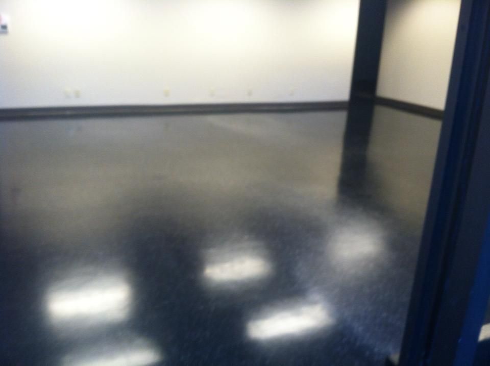 A room with a black floor and white walls