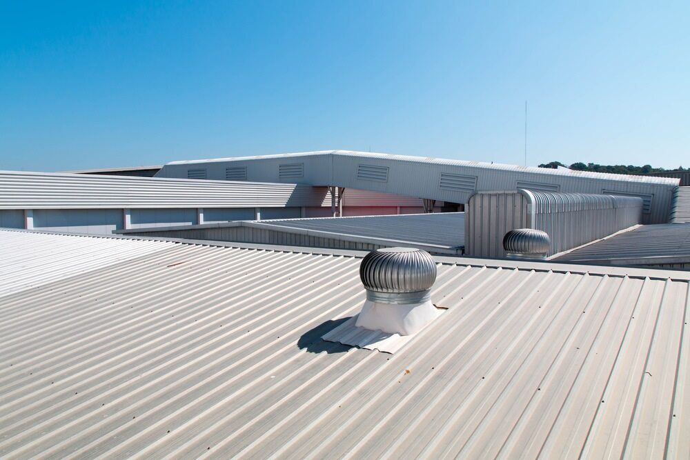 The Roof of a Building With a Ventilation Fan on It — Andergrove Plumbing & Drainage Pty Ltd In Richmond, QLD