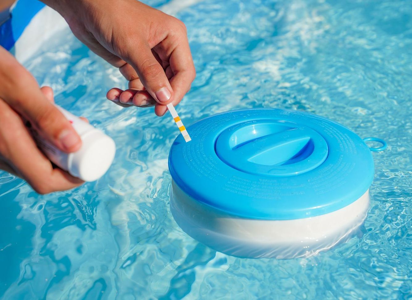 A Person is Testing the Water in a Swimming Pool — Lismore Poolscene in Goonellabah, NSW