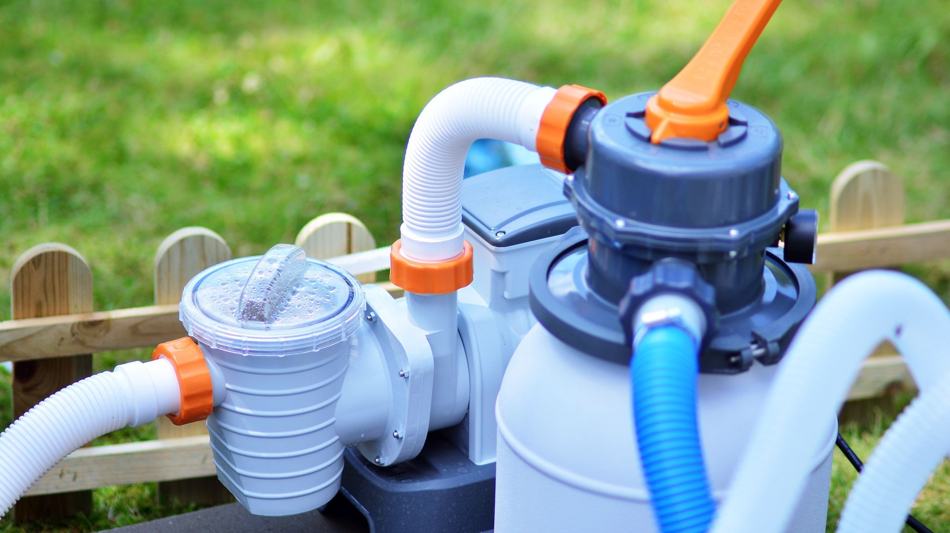 A Pool Filter With a Hose Attached to It — Lismore Poolscene in Wollongbar, NSW