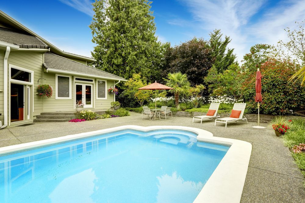 There is a Large Swimming Pool in the Backyard of a House — Lismore Poolscene in Nimbin, NSW