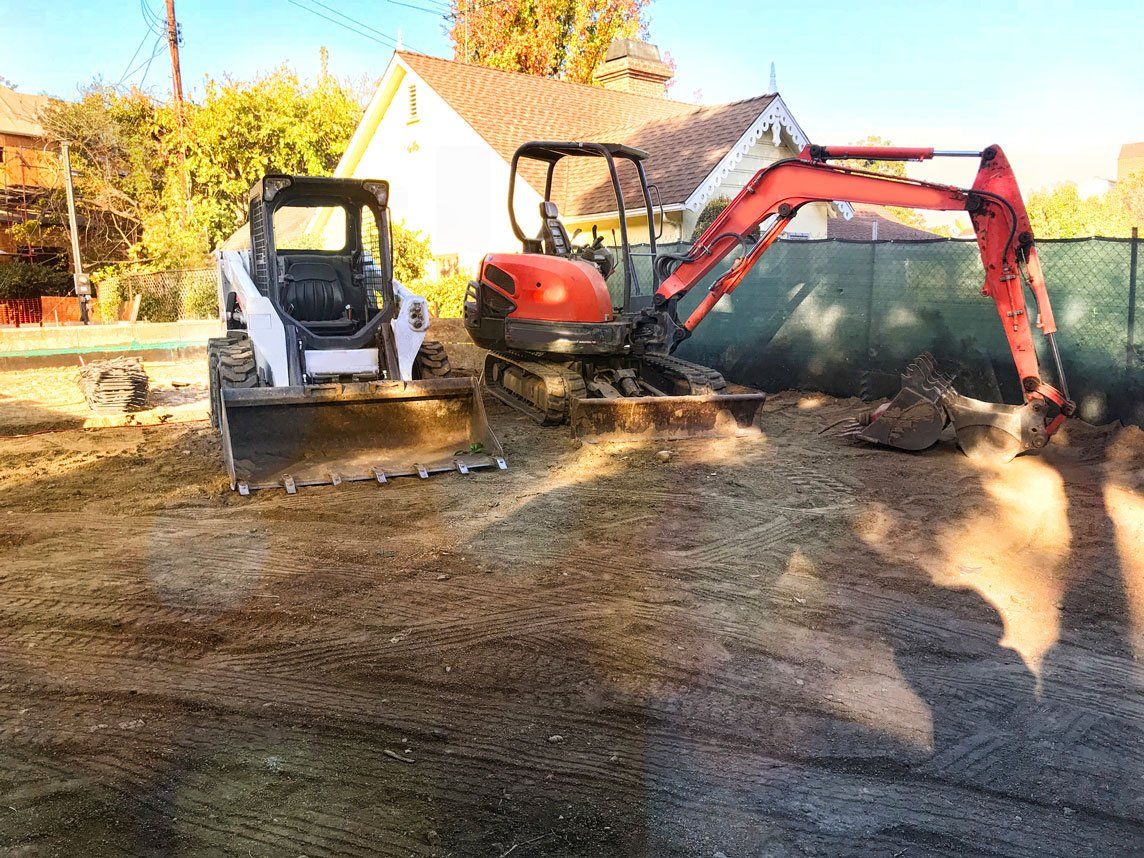 Digging and clearing out the construction site — Asheville, NC — Down To Earth Grading Inc.