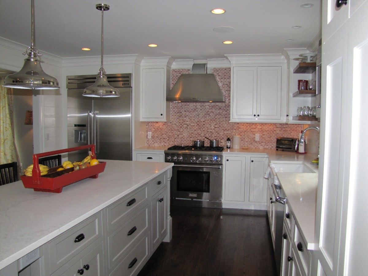 Square inset cabinetry in white and grey