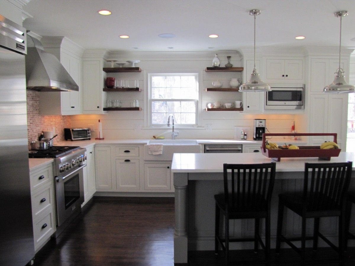 View to sink with floating walnut shelves