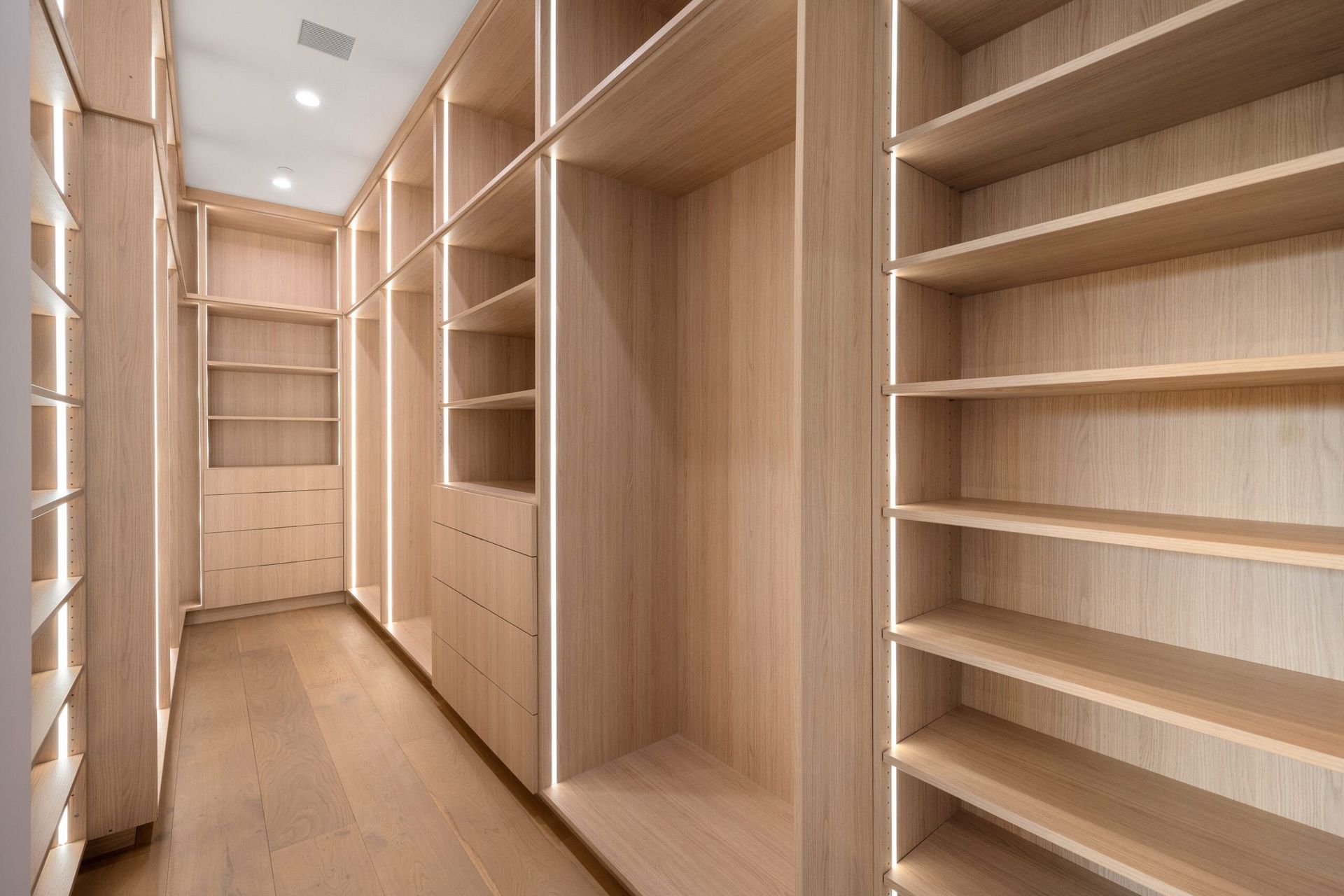 Empty, Modern Closet With Light Wooden Shelves — Keilbach Kitchens in Garradunga, QLD