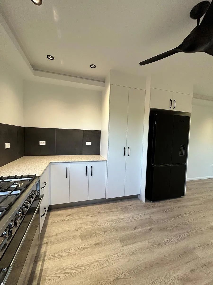 Modern Kitchen With White Cabinets — Keilbach Kitchens In Garradunga, QLD