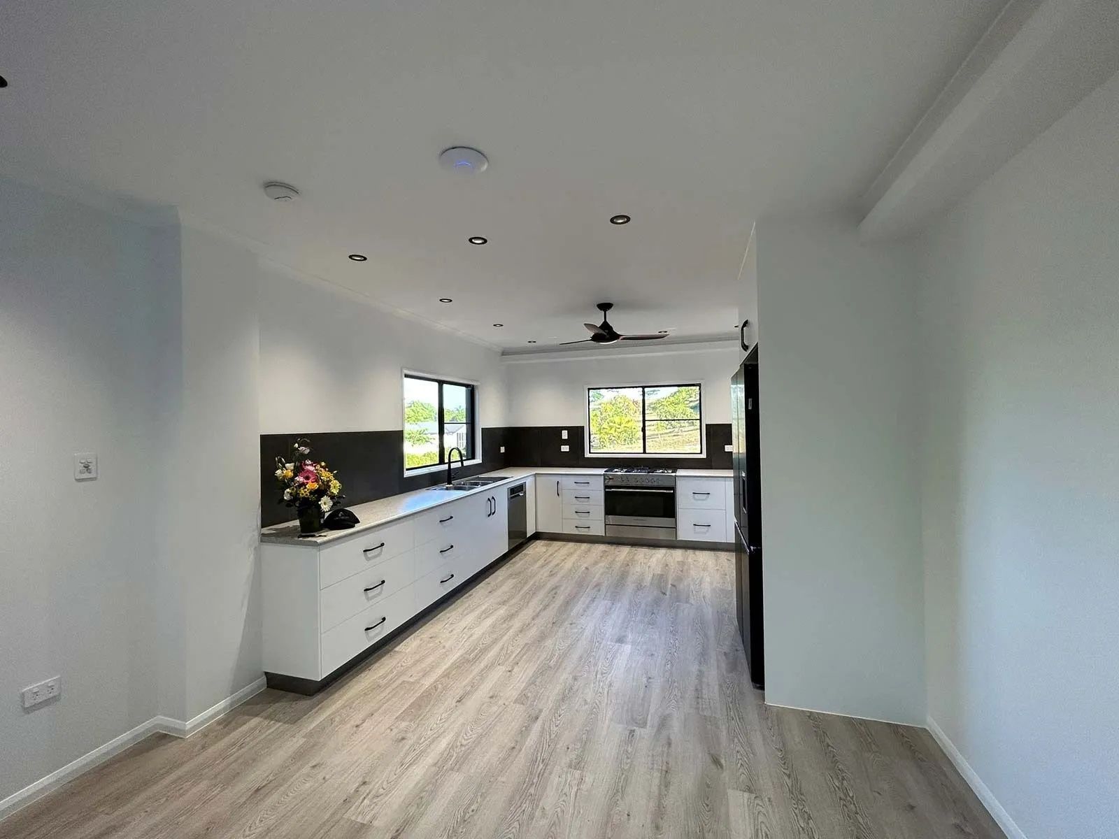Modern Kitchen With White Cabinets — Keilbach Kitchens In Garradunga, QLD