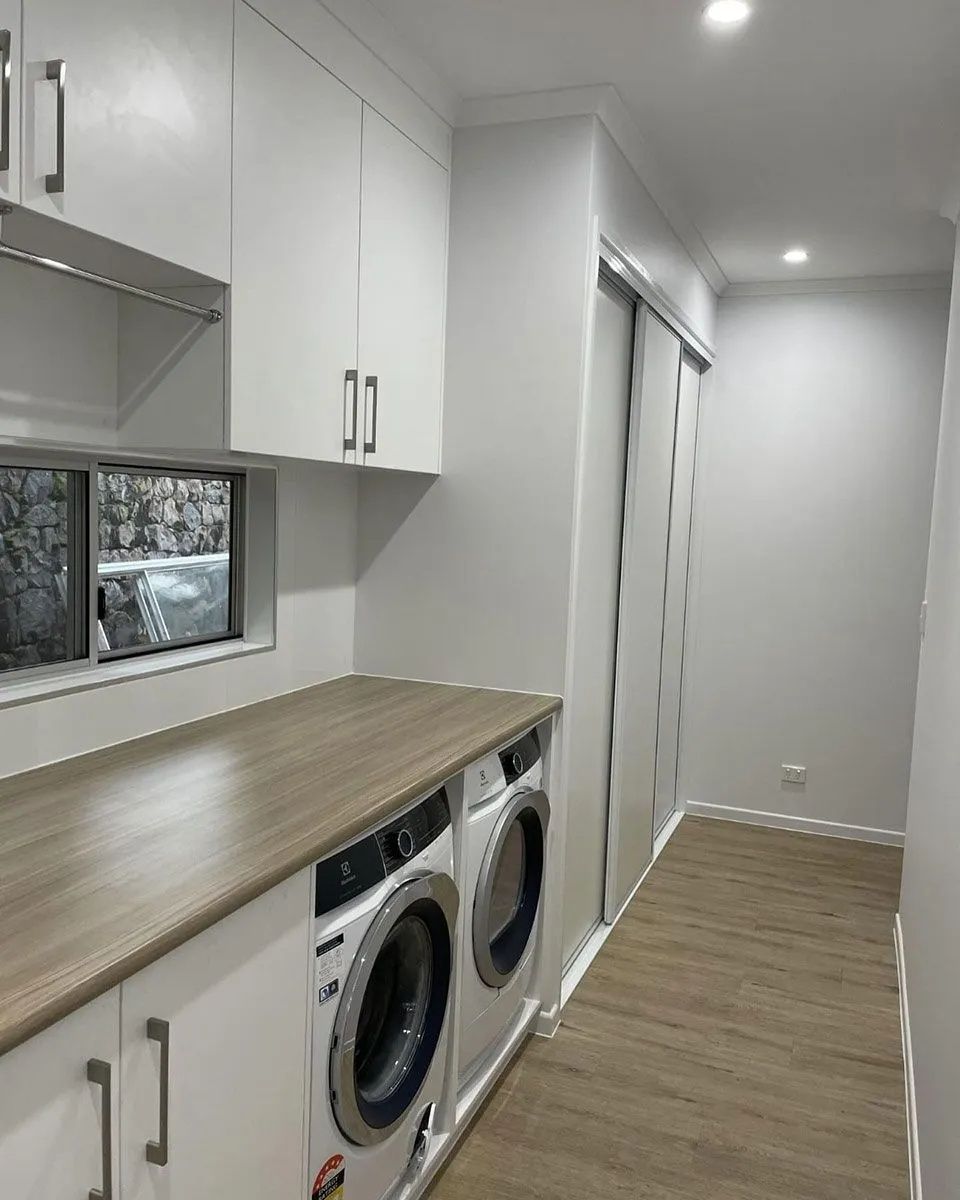 Laundry Room With White Cabinets — Keilbach Kitchens In Garradunga, QLD