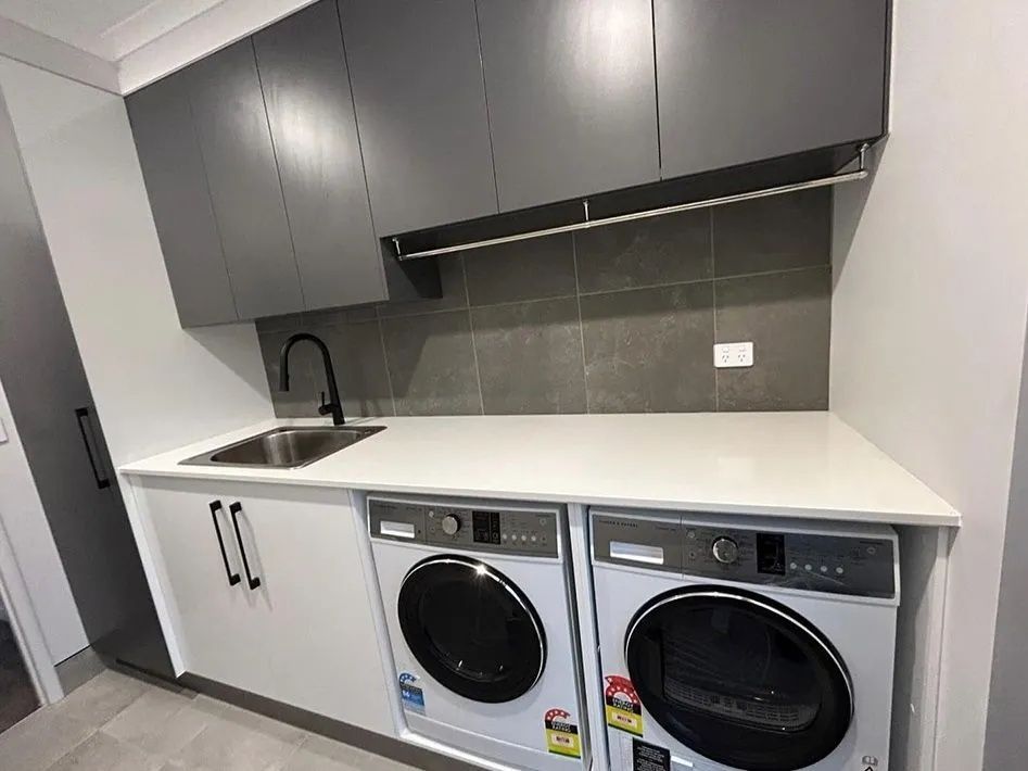 Laundry Room With Gray and White Cabinets — Keilbach Kitchens In Garradunga, QLD