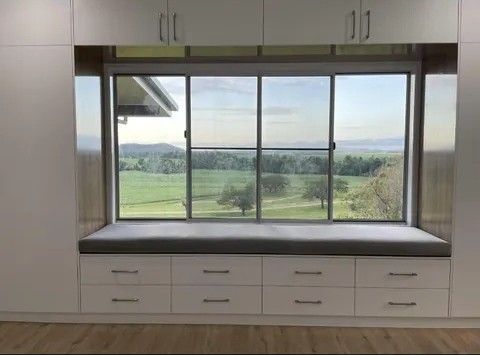 Built-in Window Seat With a View of a Green Field — Keilbach Kitchens in Garradunga, QLD