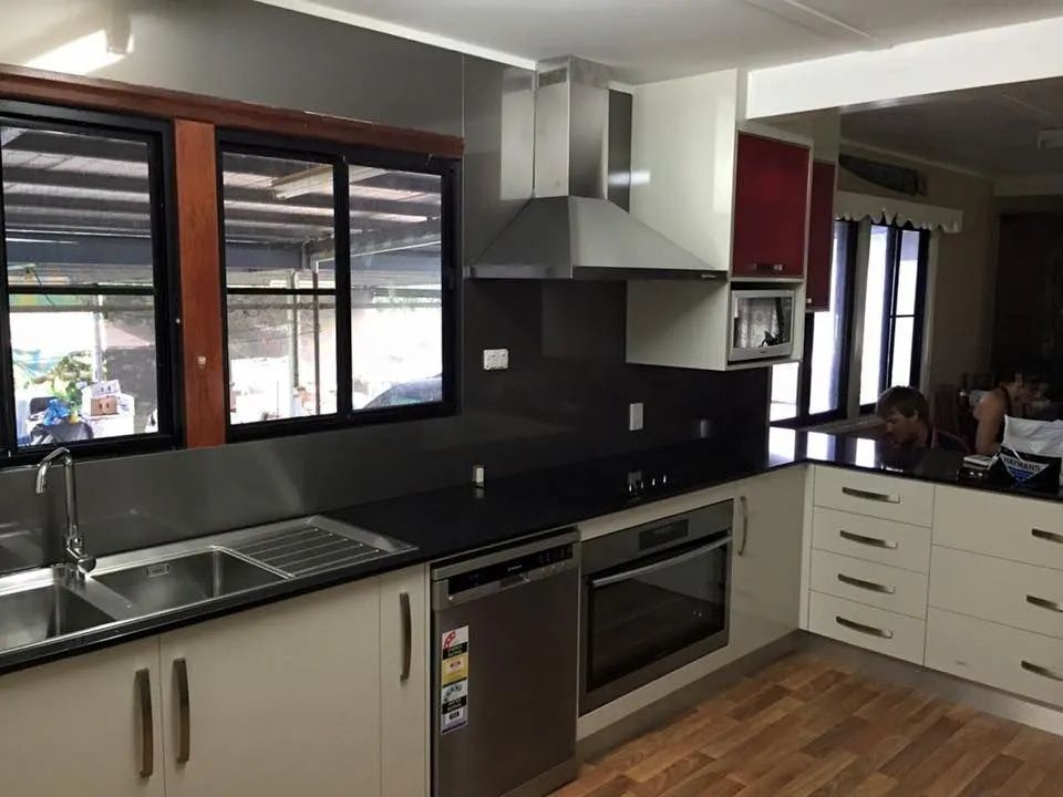 Modern Kitchen With Stainless Steel Appliances — Keilbach Kitchens in Garradunga, QLD