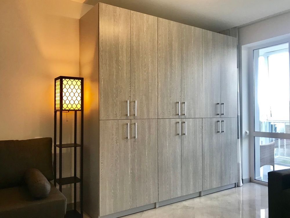 Tall Gray Storage Cabinets in a Room — Keilbach Kitchens in Garradunga, QLD
