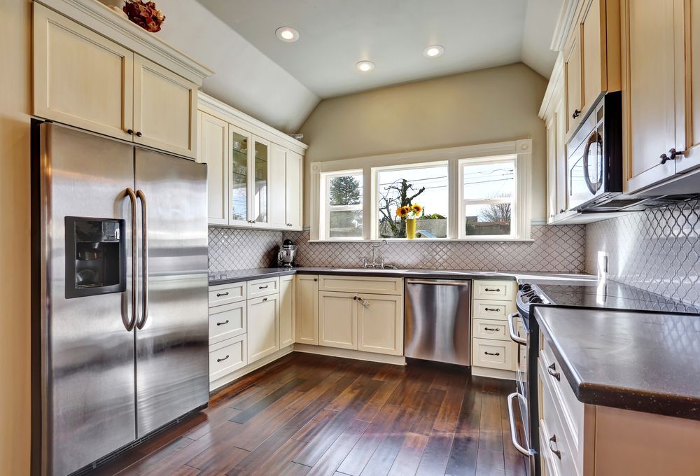 Kitchen With Stainless Steel Appliances — Keilbach Kitchens in Cassowary Coast, QLD