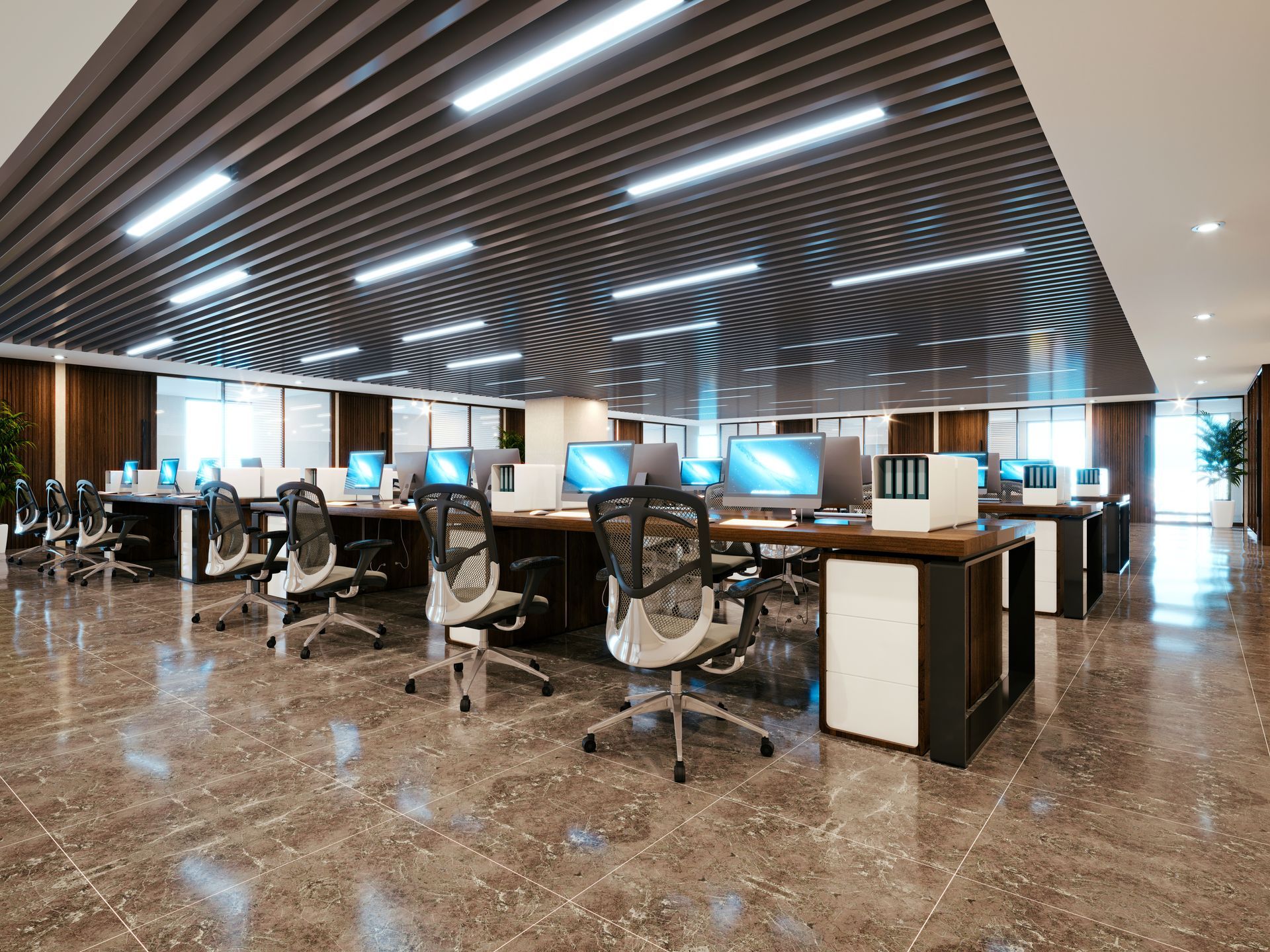 Modern office with workstations, computers, chairs, and a decorative, striped ceiling.
